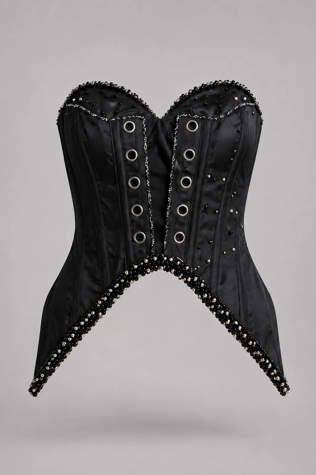 Black satin corset with eyelet front lacing and beaded edges