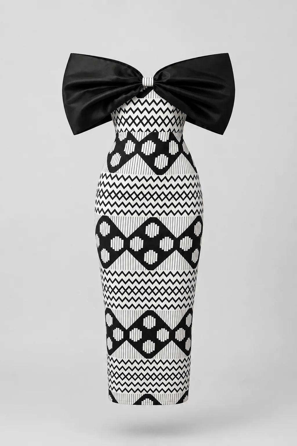 Black and white geometric print pencil dress with an oversized black bow at the neckline