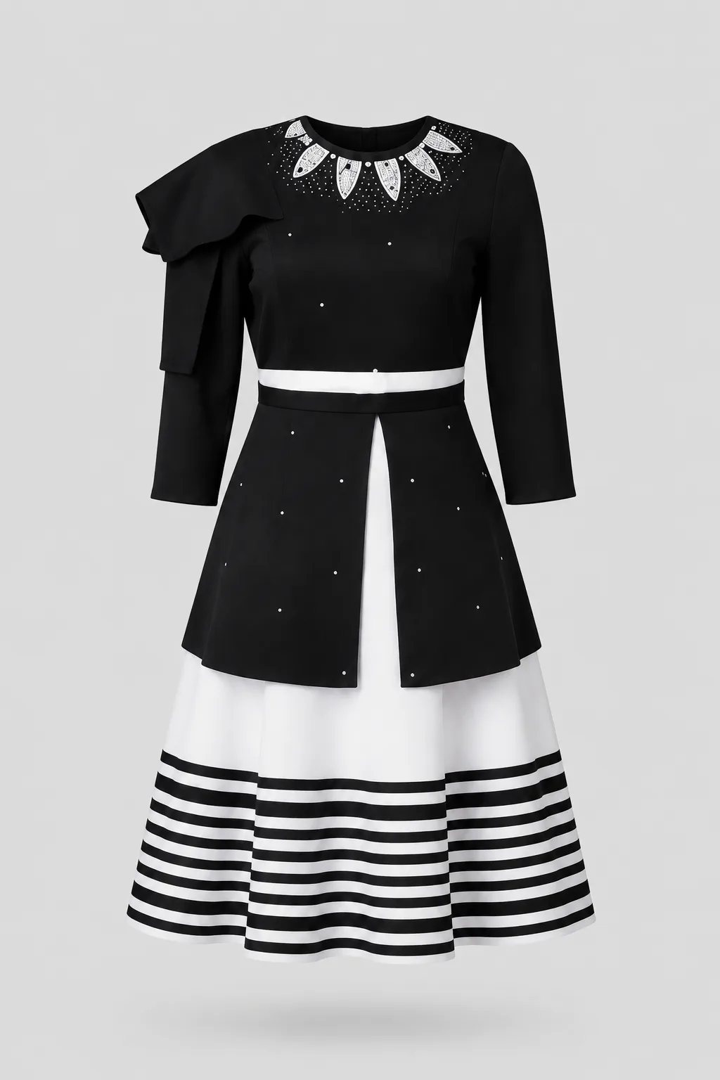 Black dress with a beaded neckline, structured shoulder detail and black-and-white striped flared skirt
