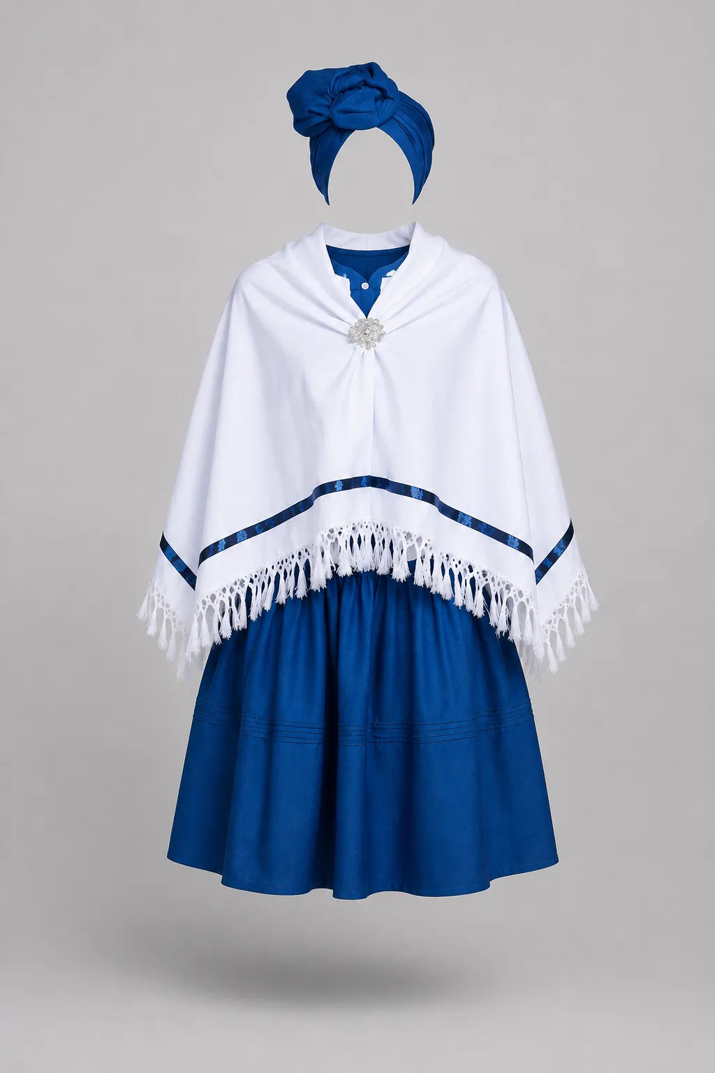 Royal blue dress with a white fringed shawl fastened with a brooch and a matching blue headwrap