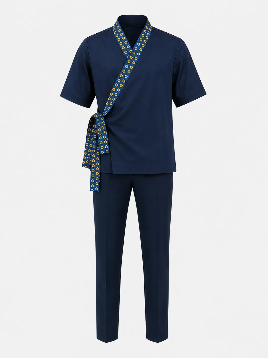 Men's navy wrap-front top with a printed tie and trim, worn with matching navy trousers