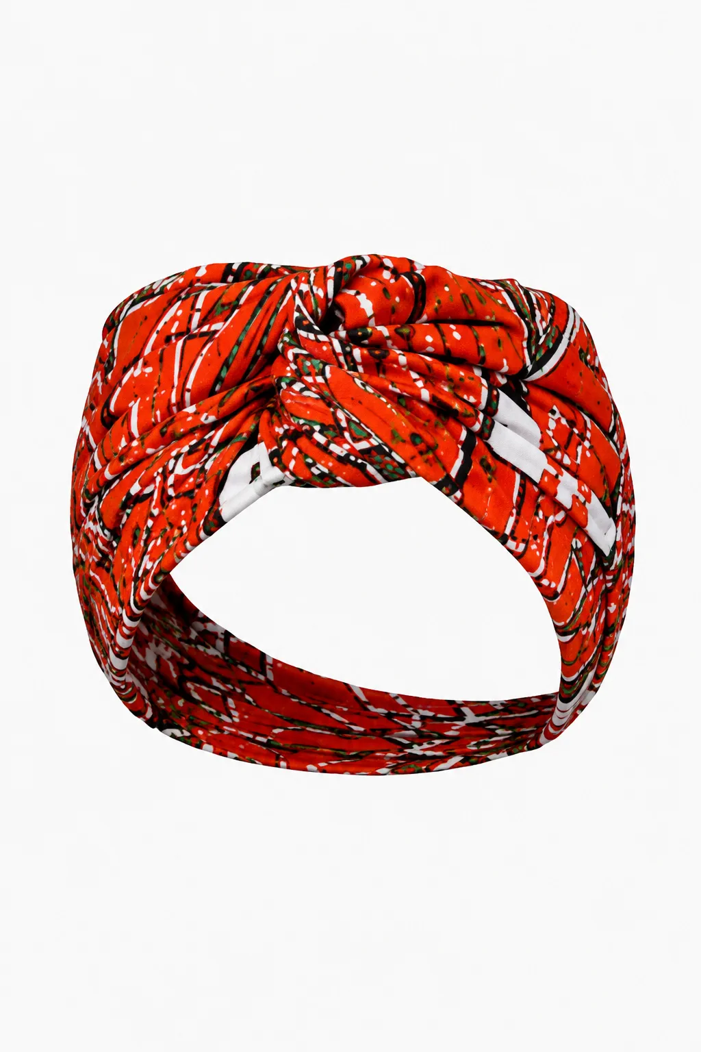 Red and white printed headwrap with a knotted front